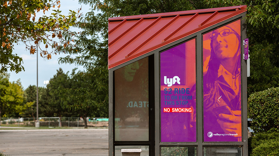 Bus stop with a lyft sign
